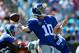 CHARLOTTE, NC - SEPTEMBER 22: Eli Manning #10 of the New York Giants drops back to pass against the Carolina Panthers during their game at Bank of America Stadium on September 22, 2013 in Charlotte, North Carolina. (Photo by Streeter Lecka/Getty Images)