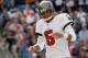 FOXBORO, MA - SEPTEMBER 22: Josh Freeman #5 of the Tampa Bay Buccaneers reacts after throwing an incomplete pass in the second half against the New England Patriots at Gillette Stadium on September 22, 2013 in Foxboro, Massachusetts. (Photo by Jim Rogash/Getty Images)
