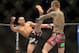 Sep 21, 2013; Toronto, Ontario, CAN; Renan Barao (left) throws a kick at Eddie Wineland during their interim bantamweight championship bout at UFC 165 at the Air Canada Centre. Mandatory Credit: Tom Szczerbowski-USA TODAY Sports