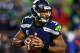 SEATTLE, WA - SEPTEMBER 15: Russell Wilson #3 of the Seattle Seahawks looks to throw the ball against the San Francisco 49ers during their game at Qwest Field on September 15, 2013 in Seattle, Washington. (Photo by Jonathan Ferrey/Getty Images)