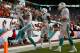 MIAMI GARDENS, FL - SEPTEMBER 22: Brian Hartline #82 of the Miami Dolphins reacts to scoring a touchdown pass during a game against the Atlanta Falcons at Sun Life Stadium on September 22, 2013 in Miami Gardens, Florida. (Photo by Mike Ehrmann/Getty Images)