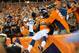 DENVER, CO - SEPTEMBER 5: Wide receiver Andre Caldwell #12 of the Denver Broncos celebrates a third quarter touchdown during the game against the Baltimore Ravens at Sports Authority Field at Mile High on September 5, 2013 in Denver Colorado. (Photo by Dustin Bradford/Getty Images)