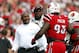 LOUISVILLE, KY - SEPTEMBER 21: Charlie Strong head coach of the Louisville Cardinals talks with Roy Philon #93 of the Cardinal during their game against Florida International Panthers at Papa John's Cardinal Stadium on September 21, 2013 in Louisville, Kentucky. (Photo by John Sommers II/Getty Images)