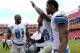 Sep 22, 2013; Landover, MD, USA; Detroit Lions wide receiver Calvin Johnson (81) celebrates with free safety Louis Delmas (26) and wide receiver Nate Burleson (13) after their game against the Washington Redskins at FedEx Field. The Lions won 27-20. Mandatory Credit: Geoff Burke-USA TODAY Sports