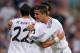 MADRID, SPAIN - SEPTEMBER 22: Cristiano Ronaldo (R) of Real Madrid congratulates his team-mate Isco on scoring their 3rd goal during the La Liga match between Real Madrid and Getafe at Bernabeu stadium on September 22, 2013 in Madrid, Spain. (Photo by Denis Doyle/Getty Images)
