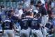 Sep 22, 2013; Chicago, IL, USA; Members of the Atlanta Braves celebrate on the field after the game against the Chicago Cubs at Wrigley Field. The Braves defeated the Cubs 5-2 and clinched the National League eastern division championship. Mandatory Credit: Jerry Lai-USA TODAY Sports