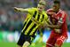 LONDON, ENGLAND - MAY 25: Marco Reus of Borussia Dortmund (L) in action with Jerome Boateng of Bayern Muenchen during the UEFA Champions League final match between Borussia Dortmund and FC Bayern Muenchen at Wembley Stadium on May 25, 2013 in London, United Kingdom. (Photo by Laurence Griffiths/Getty Images)