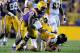 BATON ROUGE, LA - SEPTEMBER 29: Grant Enders #14 of the Towson Tigers is sacked by Anthony Johnson #90 of the LSU Tigers during a game at Tiger Stadium on September 29, 2012 in Baton Rouge, Louisiana. LSU would win the game 38-22. (Photo by Stacy Revere/Getty Images)