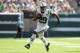 Sep 8, 2013; East Rutherford, NJ, USA; New York Jets running back Bilal Powell (29) rushes with the ball against the Tampa Bay Buccaneers during the fourth quarter of a game at MetLife Stadium. The Jets won 18-17. Mandatory Credit: Brad Penner-USA TODAY Sports
