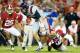 TUSCALOOSA, AL - SEPTEMBER 29: Bo Wallace #14 of the Mississippi Rebels breaks a tackle by Quinton Dial #90 of the Alabama Crimson Tide at Bryant-Denny Stadium on September 29, 2012 in Tuscaloosa, Alabama. (Photo by Kevin C. Cox/Getty Images)