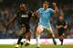 MANCHESTER, ENGLAND - SEPTEMBER 24: James Milner of Manchester City is tackled by Emmerson Boyce of Wigan Athletic during the Capital One Cup third round match between Manchester City and Wigan Athletic at Etihad Stadium on September 24, 2013 in Manchester, England. (Photo by Alex Livesey/Getty Images)