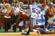 AUSTIN, TX - SEPTEMBER 21: Johnathan Gray #32 of the Texas Longhorns scores a touchdown against Ryan Mueller #44 and Blake Slaughter #53 of the Kansas State Wildcats at Darrell K Royal-Texas Memorial Stadium on September 21, 2013 in Austin, Texas. (Photo by Ronald Martinez/Getty Images)