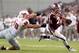HOUSTON, TX- SEPTEMBER 21: Johnny Manziel #2 of the Texas A&M Aggies rushes past Zach Wood #90 of the Southern Methodist Mustangs in the first half on September 21, 2013 at Kyle Field in College Station, Texas. (Photo by Thomas B. Shea/Getty Images)