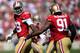 SAN FRANCISCO, CA - SEPTEMBER 22: Aldon Smith #99 and Ray McDonald #91 congratulates each other after they sacked Andrew Luck quarterback of the Indianapolis Colts during the first quarter at Candlestick Park on September 22, 2013 in San Francisco, California. (Photo by Thearon W. Henderson/Getty Images)
