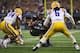 ARLINGTON, TX - AUGUST 31: B.J. Catalon #23 of the TCU Horned Frogs runs the ball against Micah Eugene #34 of the LSU Tigers and Craig Loston #6 of the LSU Tigers at AT&T Stadium on August 31, 2013 in Arlington, Texas. (Photo by Ronald Martinez/Getty Images)