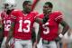 September 8, 2012; Columbus, OH, USA; Ohio State Buckeyes quarterback Kenny Guiton (13) talks with quarterback Braxton Miller (5) before their game against the UCF Knights at Ohio Stadium. Mandatory Credit: Greg Bartram-USA TODAY Sports