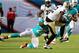 MIAMI GARDENS, FL - AUGUST 29: Receiver Marques Colston #12 of the New Orleans Saints makes a catch against Defender Jamar Taylor #22 of the Miami Dolphins at Sun Life Stadium on August 29, 2013 in Miami Gardens, Florida. (Photo by Marc Serota/Getty Images)