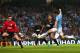 MANCHESTER, ENGLAND - SEPTEMBER 24: Stevan Jovetic of Manchester City scores the fourth goal past Lee Nicholls of Wigan Athletic during the Capital One Cup third round match between Manchester City and Wigan Athletic at Etihad Stadium on September 24, 2013 in Manchester, England. (Photo by Alex Livesey/Getty Images)