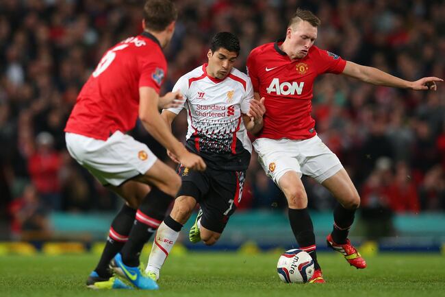 Hi-res-181804439-phil-jones-of-manchester-united-competes-with-luis_crop_north