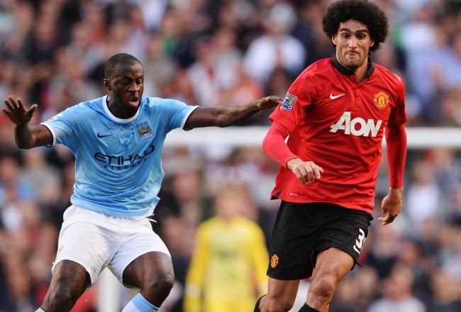 Hi-res-181542959-marouane-fellaini-of-manchester-united-evades-yaya_crop_north