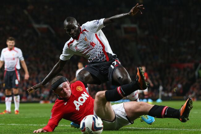 Hi-res-181801385-wayne-rooney-of-manchester-united-tangles-with-mamadou_crop_north