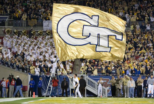 Hi-res-94030837-georgia-tech-yellow-jackets-cheerleader-waves-a-flag_crop_north