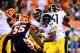 Sep 16, 2013; Cincinnati, OH, USA; Pittsburgh Steelers running back Isaac Redman (33) runs the ball against Cincinnati Bengals outside linebacker Vontaze Burfict (55) during the second quarter at Paul Brown Stadium. Mandatory Credit: Andrew Weber-USA TODAY Sports
