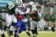 EAST RUTHERFORD, NJ - SEPTEMBER 22: Running back C.J. Spiller #28 of the Buffalo Bills attempts to break free from defensive tackle Kenrick Ellis #93 and defensive end Quinton Coples #98 of the New York Jets during the second quarter in a game at MetLife Stadium on September 22, 2013 in East Rutherford, New Jersey. (Photo by Rich Schultz /Getty Images)