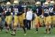SOUTH BEND, IN - SEPTEMBER 21: Head coach Brian Kelly of the Notre Dame Fighting Irish (center) moves onto the field with his team before taking on the Michigan State Spartans at Notre Dame Stadium on September 21, 2013 in South Bend, Indiana. Notre Dame defeated Michigan State 17-13. (Photo by Jonathan Daniel/Getty Images)