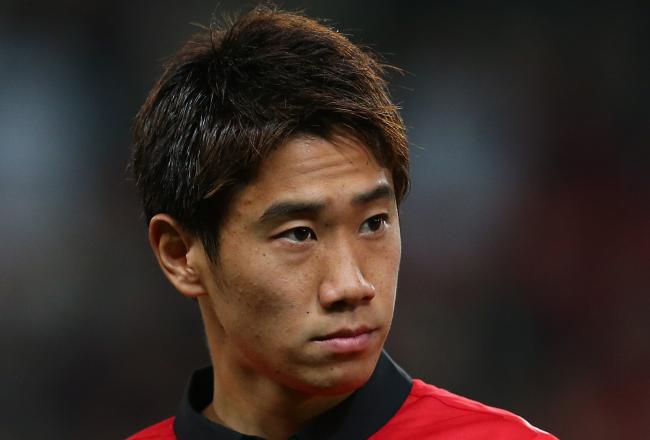 Hi-res-181800062-shinji-kagawa-of-manchester-united-looks-on-prior-to_crop_north