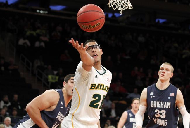 Hi-res-165294252-isaiah-austin-of-the-baylor-bears-reaches-out-for-a_crop_north