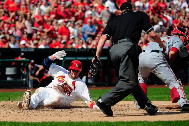 Hi-res-181802133-matt-adams-of-the-st-louis-cardinals-slides-safely-past_crop_north