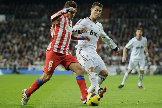 Hi-res-157353211-cristiano-ronaldo-of-real-madrid-duels-for-the-ball_crop_north