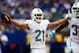 Sep 15, 2013; Indianapolis, IN, USA; Miami Dolphins cornerback Brent Grimes (21) celebrates with teammate after intercepting a pass during the third quarter against the Indianapolis Colts at Lucas Oil Stadium. Mandatory Credit: Andrew Weber-USA TODAY Sports
