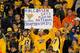 MIAMI GARDENS, FL - JANUARY 04: Fans of the West Virginia Mountaineers hold up a sign in support of head coach Dana Holgorsen against the Clemson Tigers during the Discover Orange Bowl at Sun Life Stadium on January 4, 2012 in Miami Gardens, Florida. (Photo by Streeter Lecka/Getty Images)