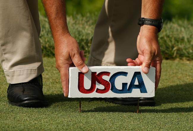 Hi-res-173391680-rules-official-sets-a-tee-marker-during-the-third-round_crop_north