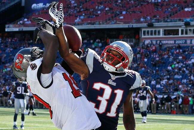 Hi-res-181571973-aqib-talib-of-the-new-england-patriots-breaks-up-a-pass_crop_north
