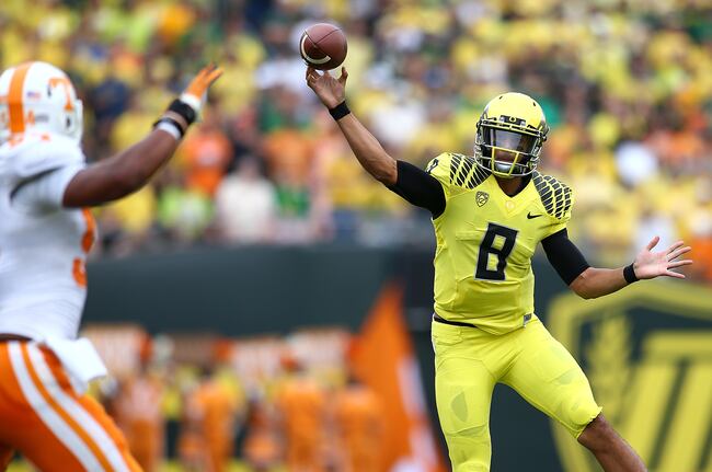 Hi-res-180554395-marcus-mariota-of-the-oregon-ducks-throws-against-of_crop_north
