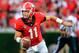 Sep 7, 2013; Athens, GA, USA; Georgia Bulldogs quarterback Aaron Murray (11) scrambles before throwing an 85-yard touchdown pass in the second half against the South Carolina Gamecocks at Sanford Stadium. Georgia won 41-30. Mandatory Credit: Daniel Shirey-USA TODAY Sports