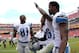 Sep 22, 2013; Landover, MD, USA; Detroit Lions wide receiver Calvin Johnson (81) celebrates with free safety Louis Delmas (26) and wide receiver Nate Burleson (13) after their game against the Washington Redskins at FedEx Field. The Lions won 27-20. Mandatory Credit: Geoff Burke-USA TODAY Sports