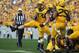 Sep 28, 2013; Morgantown, WV, USA; West Virginia Mountaineers linebacker Jared Barber (33) celebrates after making a defensive stop against the Oklahoma State Cowboys at Milan Puskar Stadium. Mandatory Credit: Peter Casey-USA TODAY Sports