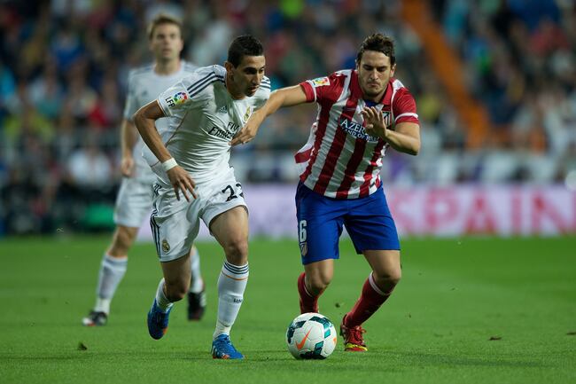 Hi-res-182139532-angel-di-maria-of-real-madrid-cf-competes-for-the-ball_crop_north