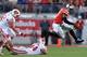 COLUMBUS, OH - SEPTEMBER 28: Quarterback Braxton Miller #5 of the Ohio State Buckeyes leaps to avoid the tackle attempt from Chris Borland #44 of the Wisconsin Badgers and Pat Muldoon #92 of the Wisconsin Badgers in the second quarter at Ohio Stadium on September 28, 2013 in Columbus, Ohio. (Photo by Jamie Sabau/Getty Images)