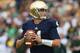 SOUTH BEND, IN - SEPTEMBER 21: Tommy Rees #11 of the Notre Dame Fighting Irish looks for a receiver against the Michigan State Spartans at Notre Dame Stadium on September 21, 2013 in South Bend, Indiana. Notre dame defeated Michigan State 17-13. (Photo by Jonathan Daniel/Getty Images)