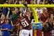 LANDOVER, MD - AUGUST 19: Linebacker Ryan Kerrigan #91 of the Washington Redskins dunks the ball over the goalpost after intercepting a pass and returning it for a touchdown during the first half of a preseason game against the Pittsburgh Steelers at FedExField on August 19, 2013 in Landover, Maryland. (Photo by Rob Carr/Getty Images)