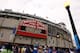 CHICAGO - OCTOBER 01: Fans stand outside Wrigley Field under the famous marquee, which reads 'Welcome to the National League Division Series' prior to the Chicago Cubs hosting the Los Angeles Dodgers in Game One of the NLDS during the 2008 MLB Playoffs at Wrigley Field on October 1, 2008 in Chicago, Illinois. (Photo by Jamie Squire/Getty Images)