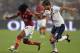 ROME, ITALY - SEPTEMBER 29: Gervinho of AS Roma (L) competes for the ball with Gyorgy Garics of Bologna during the Serie A match between AS Roma and Bologna FC at Stadio Olimpico on September 29, 2013 in Rome, Italy. (Photo by Paolo Bruno/Getty Images)
