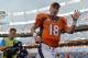 Sep 29, 2013; Denver, CO, USA; Denver Broncos quarterback Peyton Manning (18) waves as he leaves the field following the win over the Philadelphia Eagles at Sports Authority Field at Mile High. The Broncos defeated the Eagles 52-20. Mandatory Credit: Ron Chenoy-USA TODAY Sports
