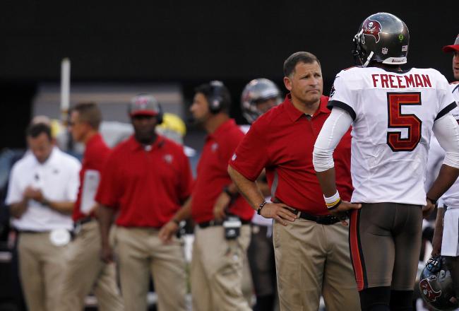 Hi-res-152094870-head-coach-greg-schiano-talks-with-josh-freeman-of-the_crop_north
