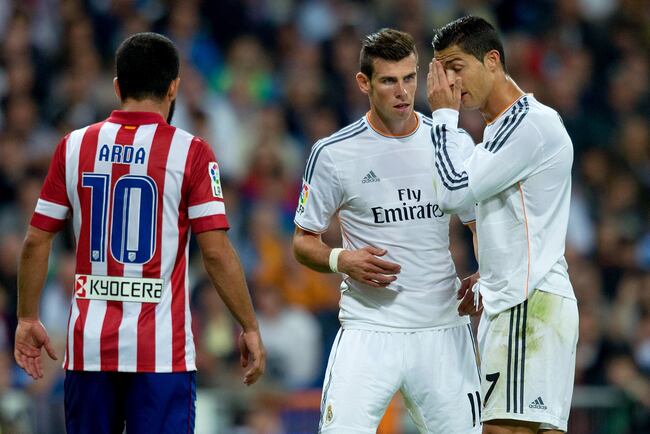 Hi-res-182172966-gareth-bale-of-real-madrid-cf-talks-with-his-team-mate_crop_north